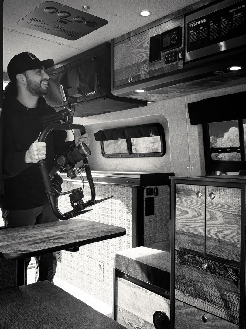 Brandon Easton filming a camper van interior with a gimbal